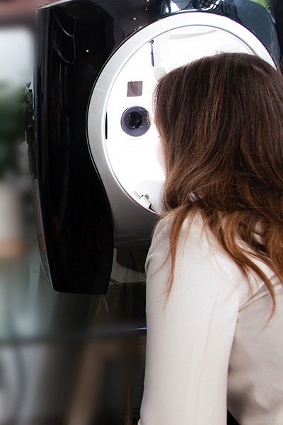 Woman with face receiving Visia Skin Analysis at SkinReMEDI at Natural Body Spa