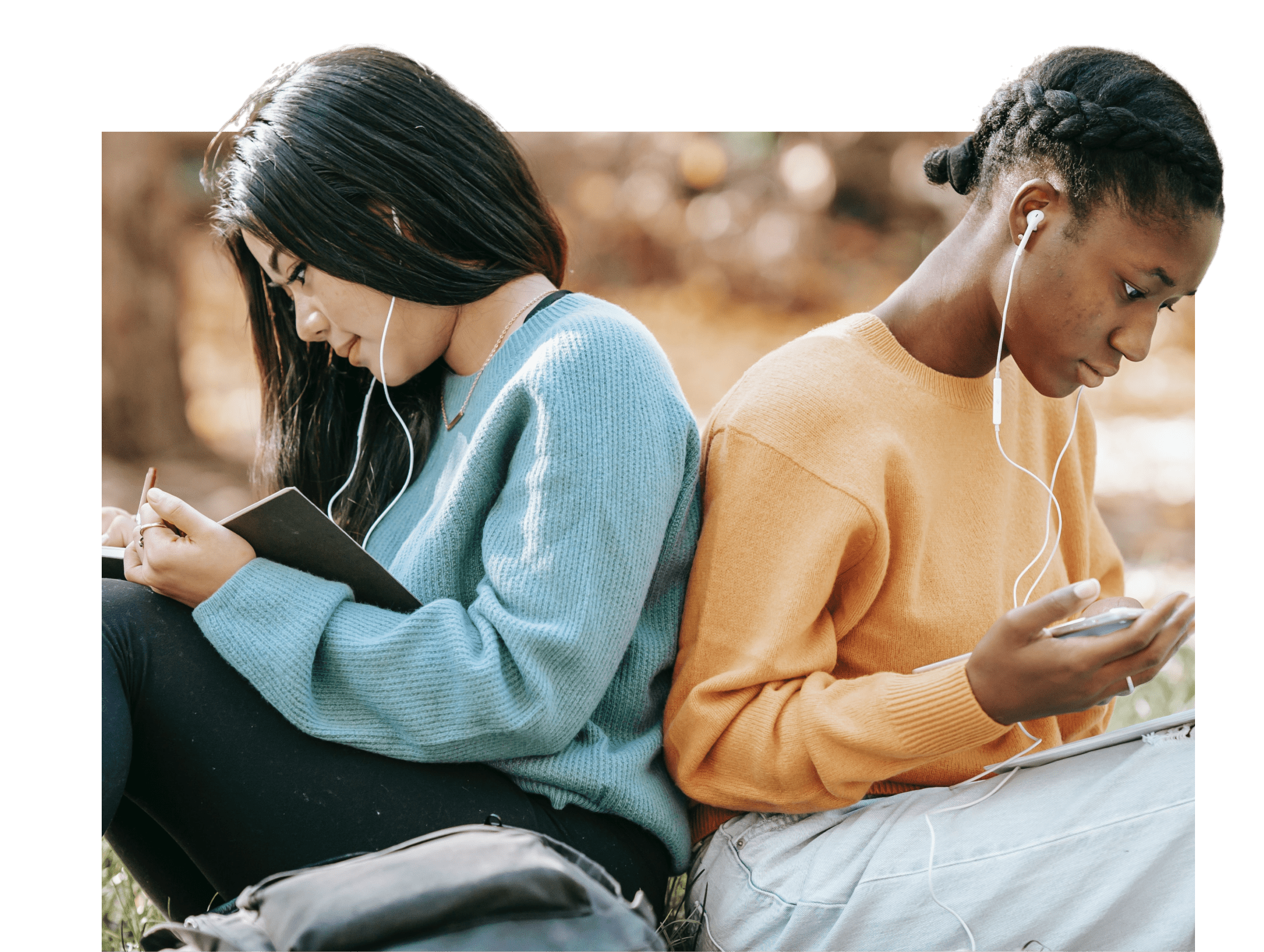 Two young women read side-by-side.