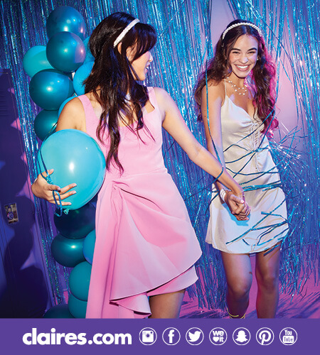 Two teen girls at a homecoming dance wearing Claire's accessories