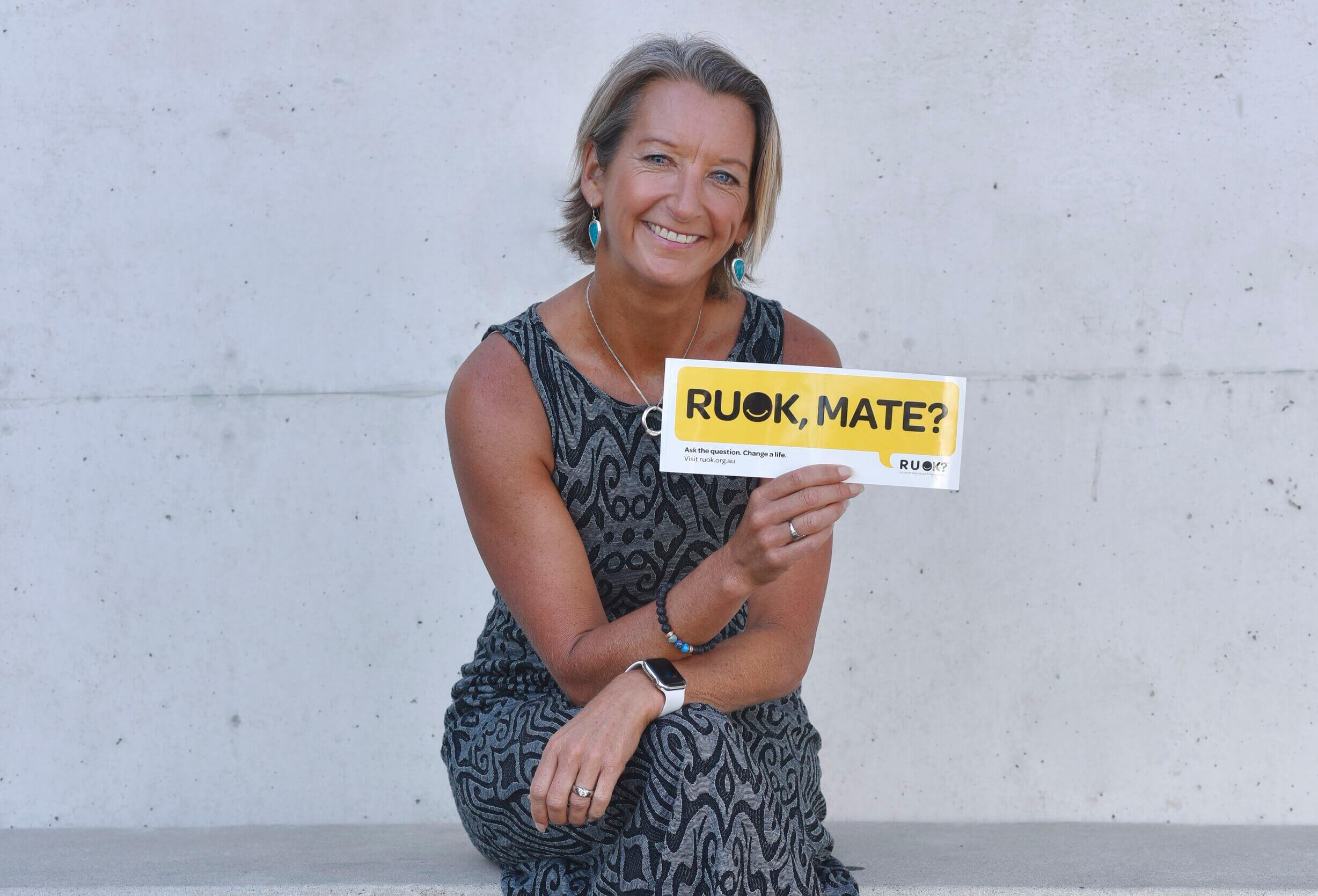 Layne Beachley holding an RUOK sticker