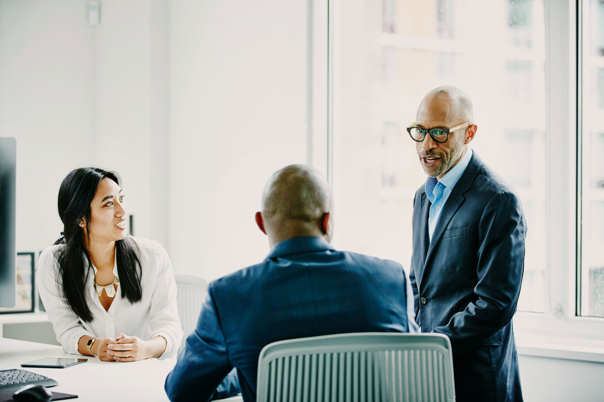 Three people meeting in an office