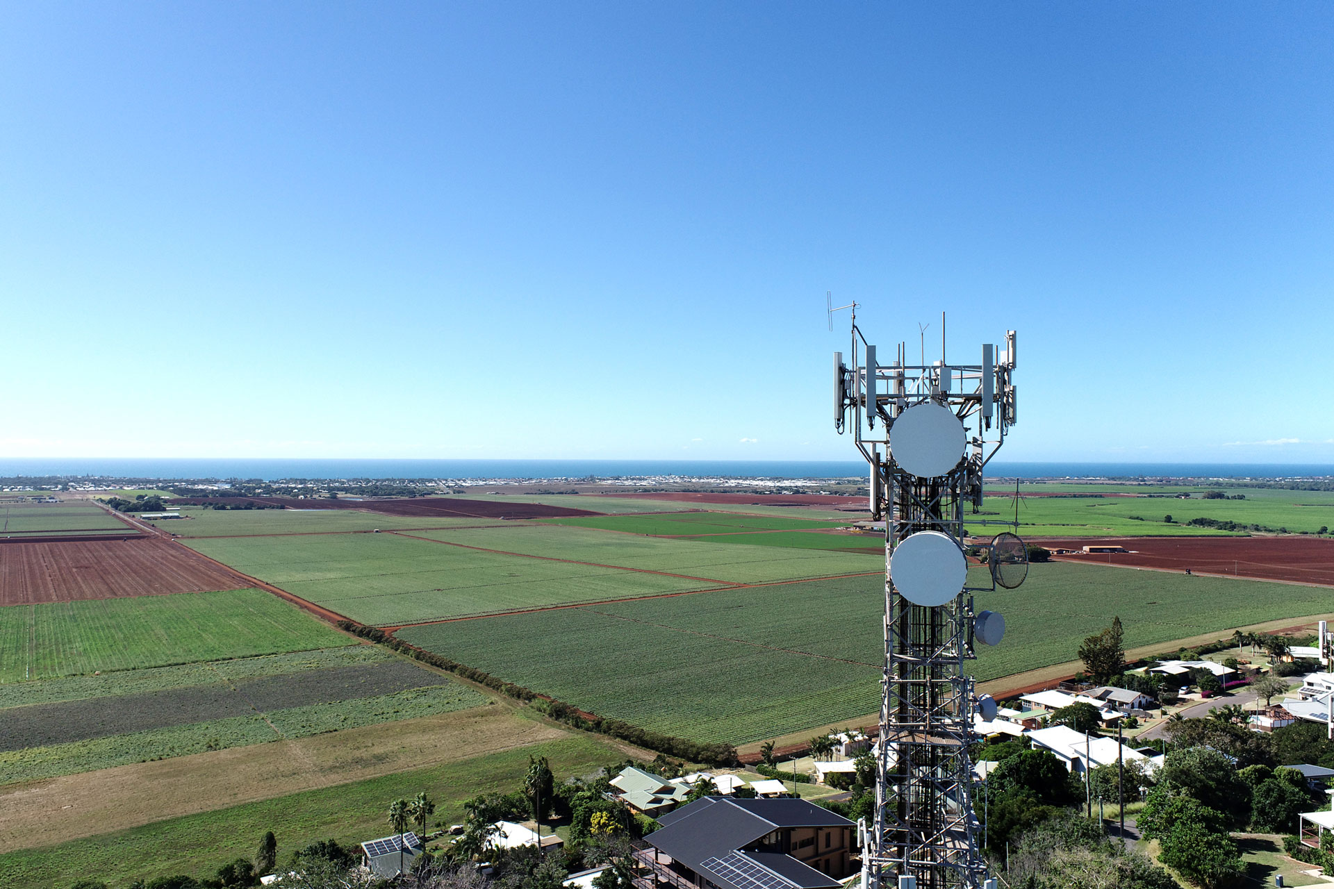 An Amplitel tower looking over country side out to the coast