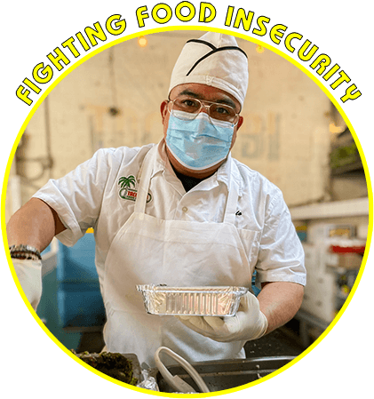 Image of employee packing charity meals