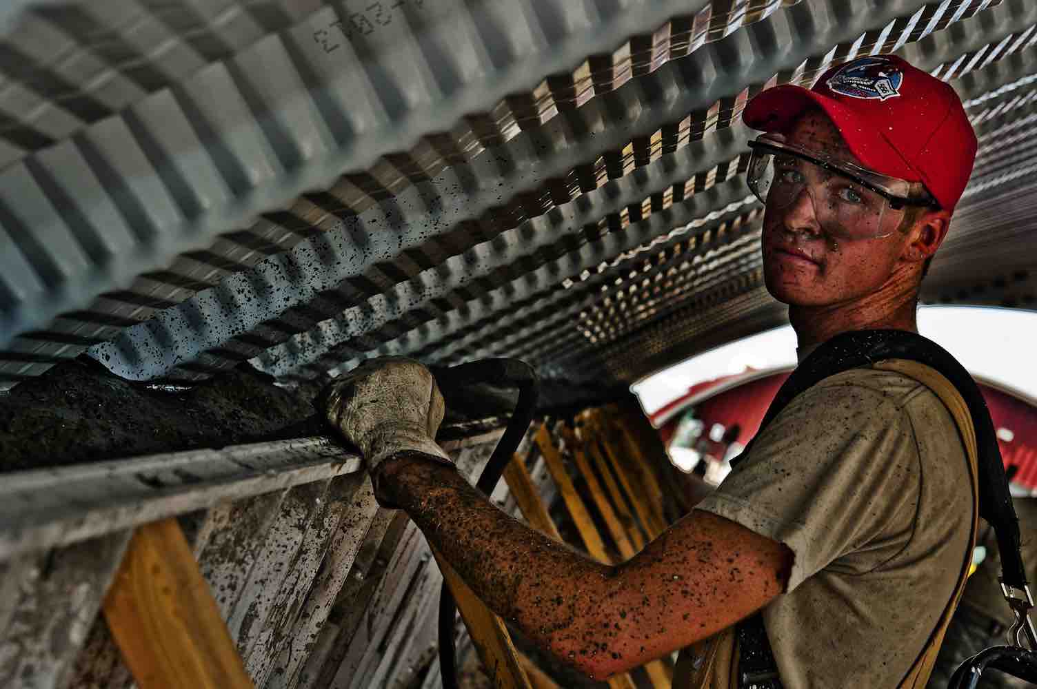 Picture of young construction worker looking dirty