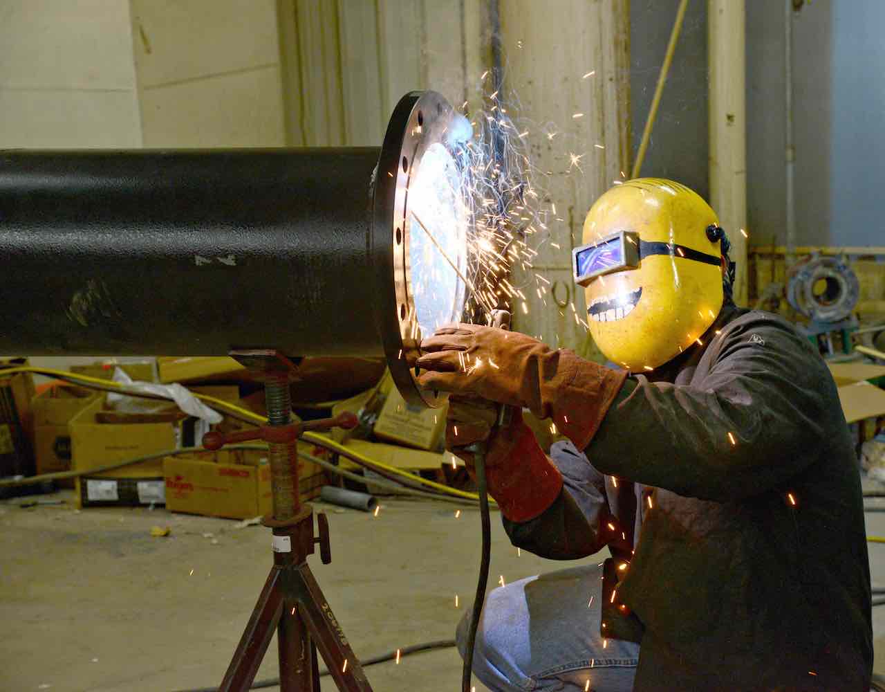 a welder welding a large pipe