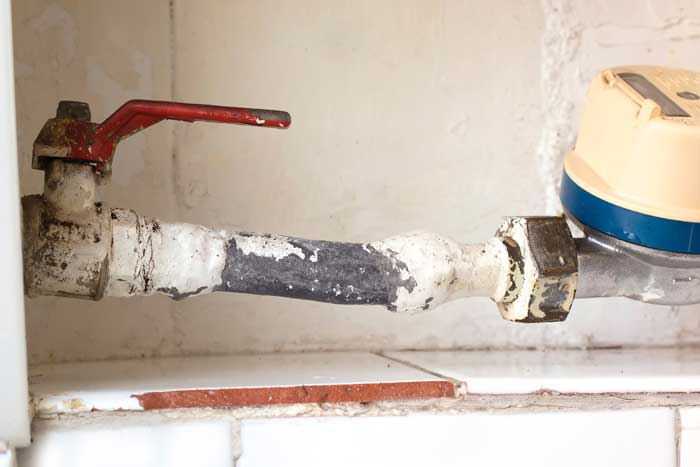 a lead service line connecting to the meter in a home