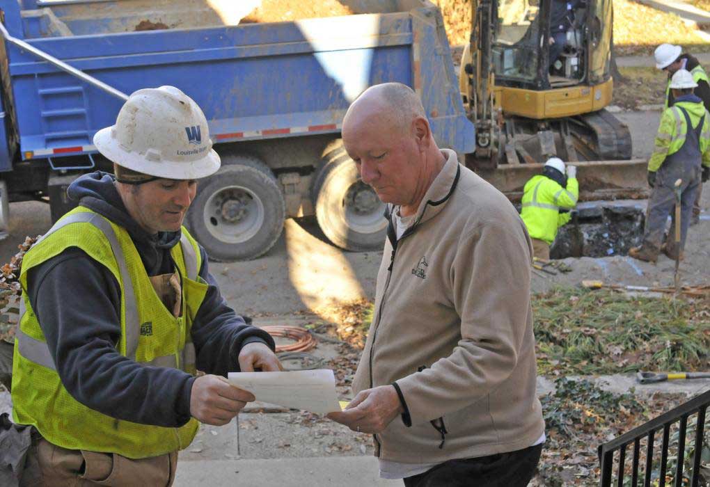a water system water discussing a replacement with a customer