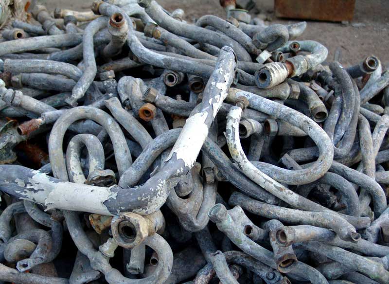A pile of lead service lines and goosenecks