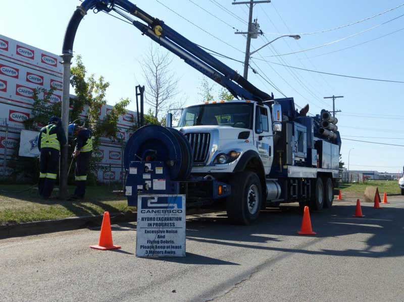A hydrovac truck performing a vacuum excavation