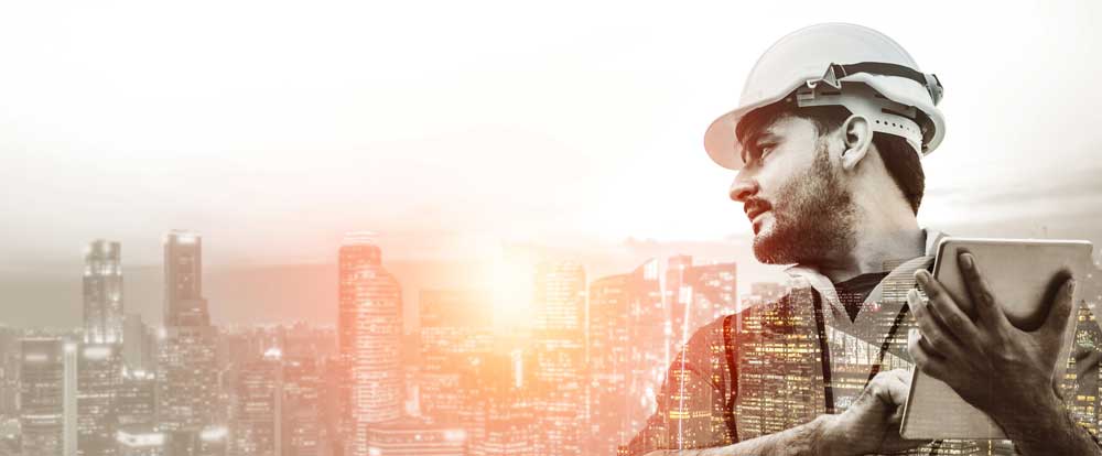 a construction worker overlooking a city using digital twin software