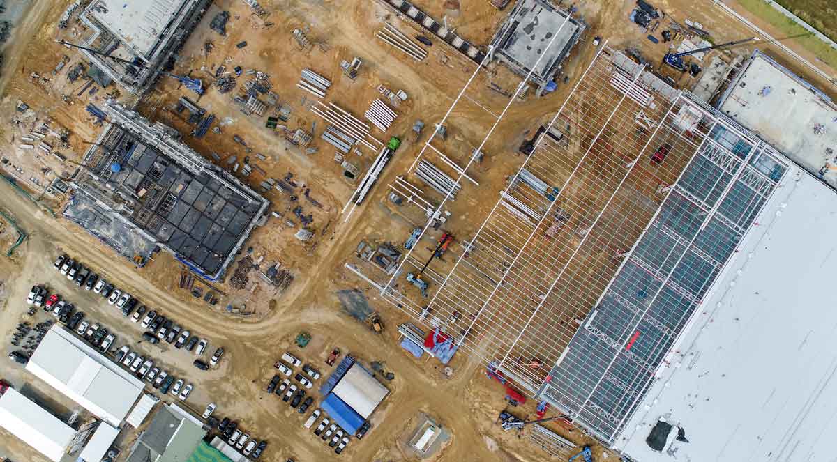 A busy construction site where progress monitoring and reporting are critical.