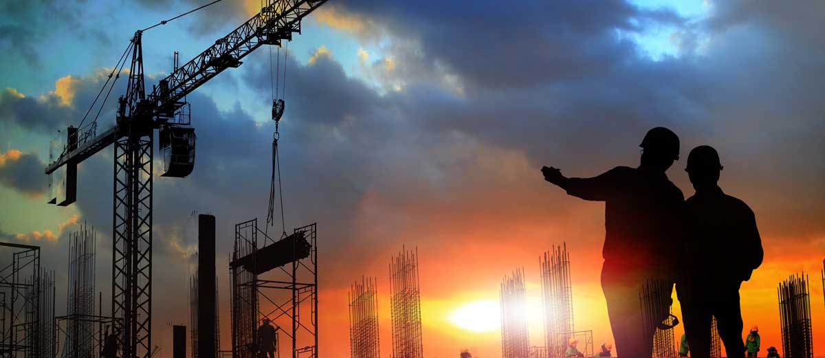 Two construction workers collaborating