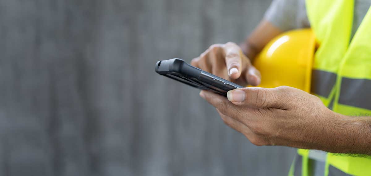 a utility field worker using mobile GIS in integrity management