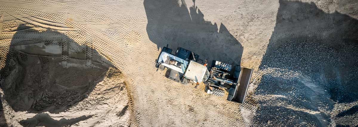 an aerial view of a bulldozer on a construction site