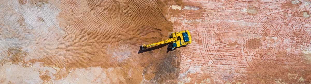 a bulldozer shoveling dirt at a construction site