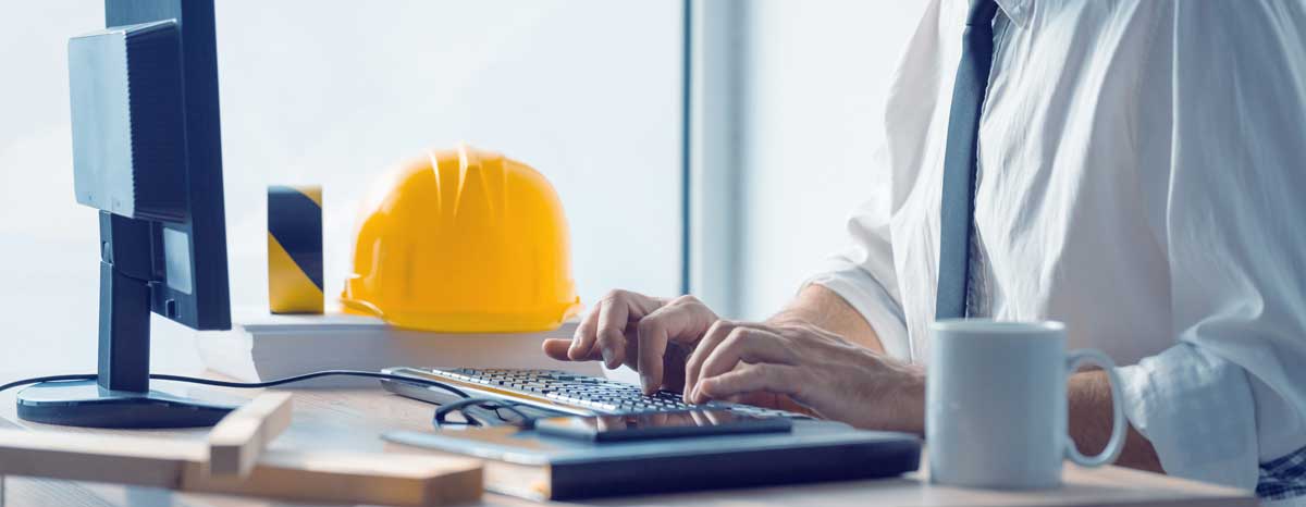 a man in an office using desktop GIS