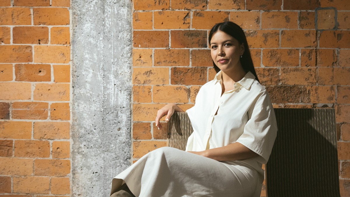 Jessie Wong from Yu Mei sitting in an armhair