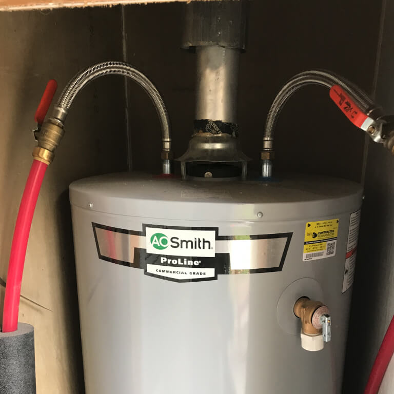 Hot water heater repair photograph of replacing and installing a hot water tank by K&K Home Solutions.