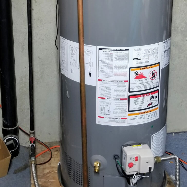 Hot water heater repair photograph of replacing and installing a hot water tank by K&K Home Solutions.