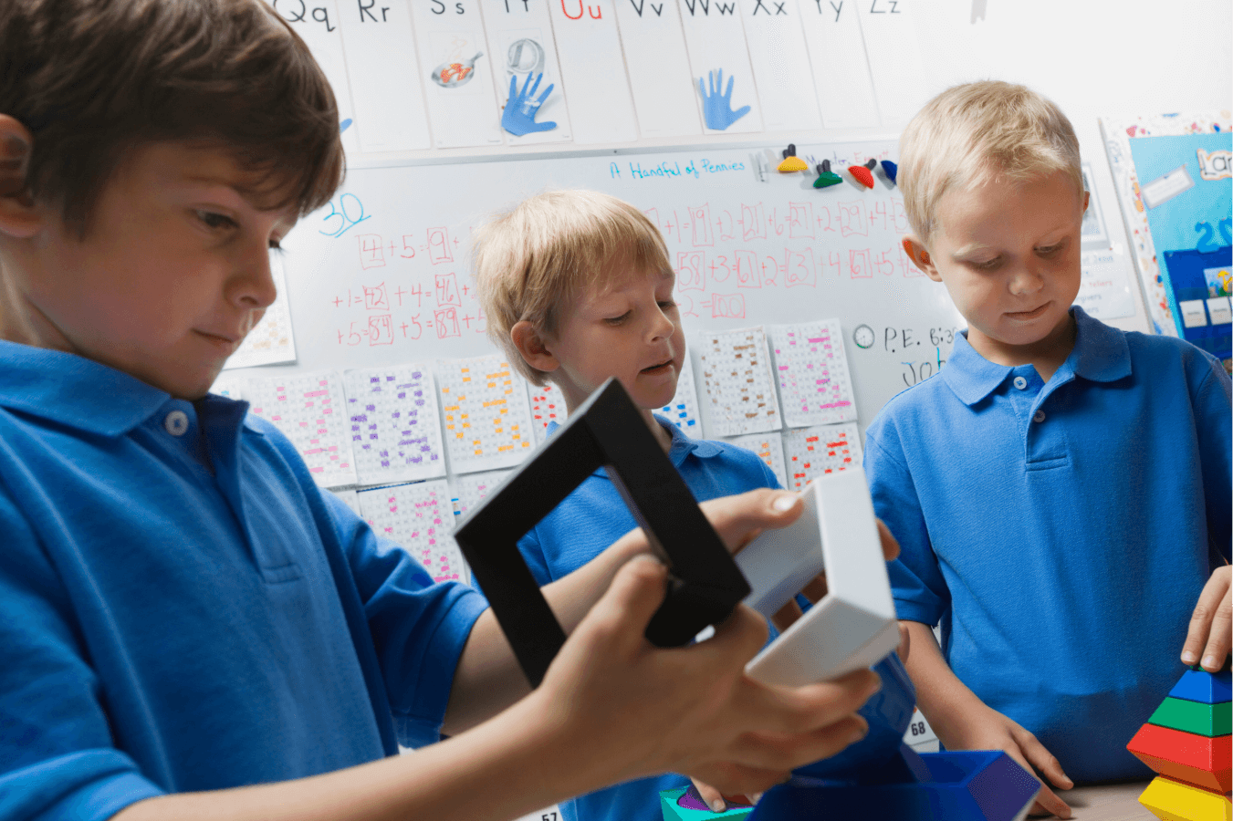 3 school boys in class in their uniform