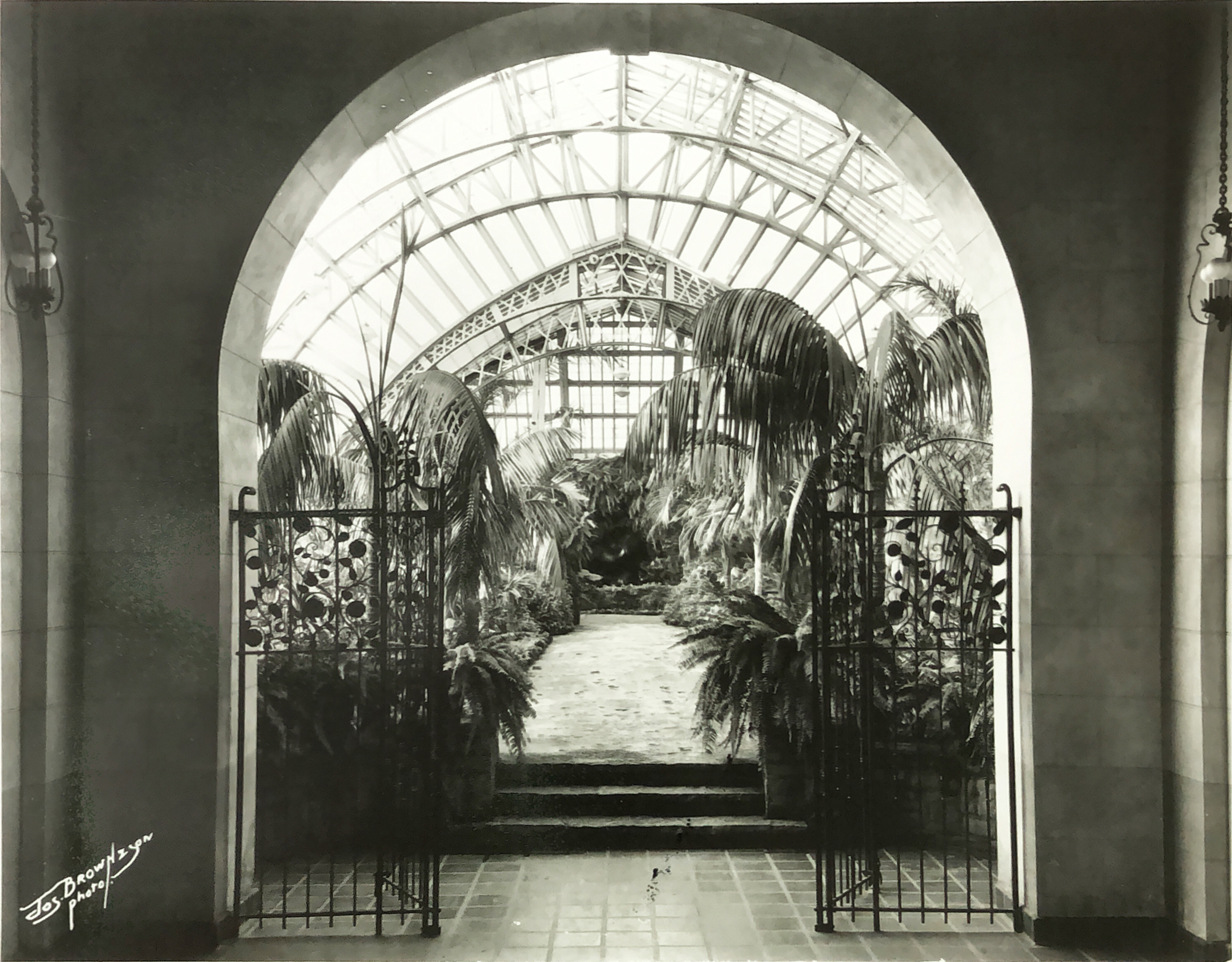 iron work gates at the entrance of the historic palm house