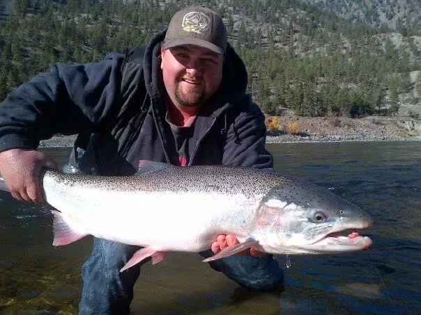 A man holding a large salmon