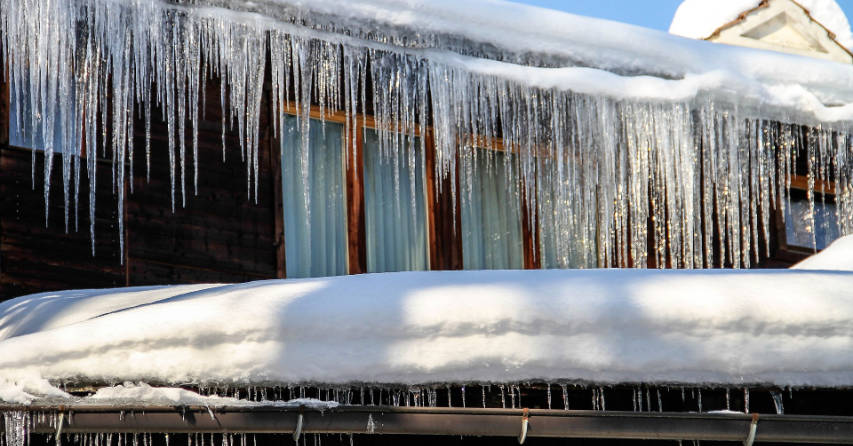 Icicles hanging from eaves trough