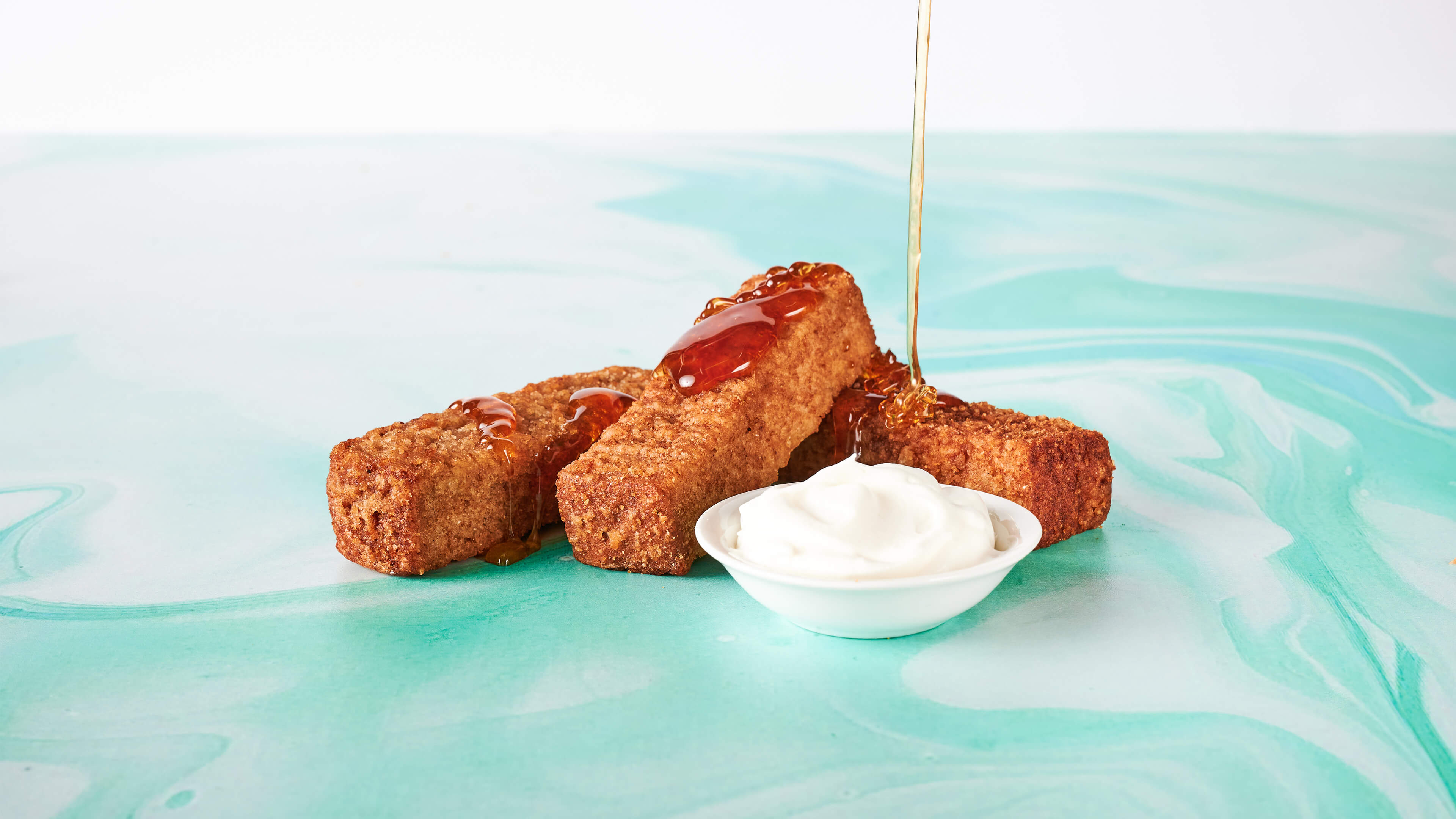 French Toast Sticks - Baked french toast sticks with whipped cream and warm maple syrup for dipping