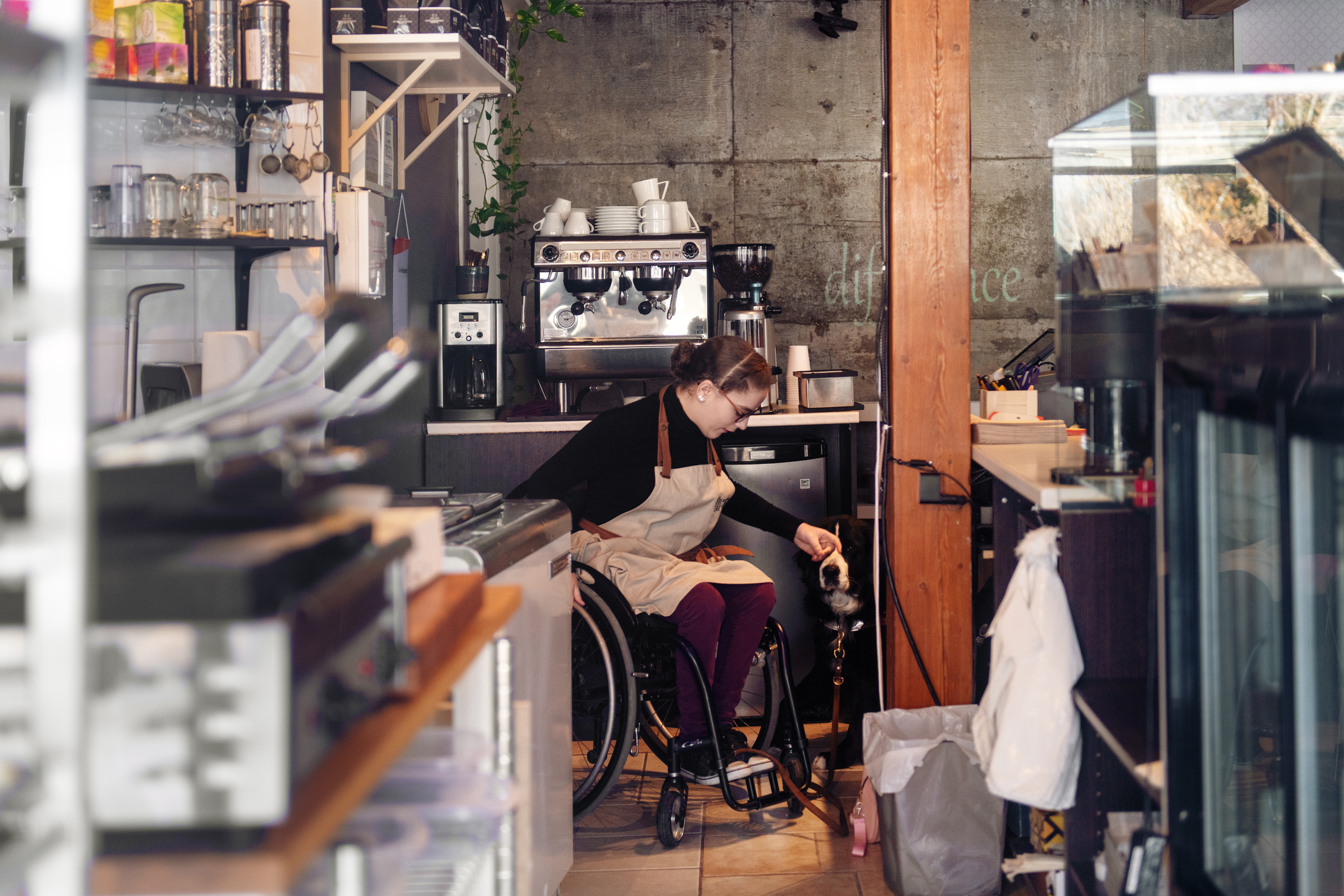 Disabled woman working in bakery cafe