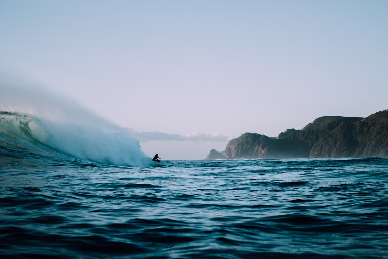 surfer riding big wave