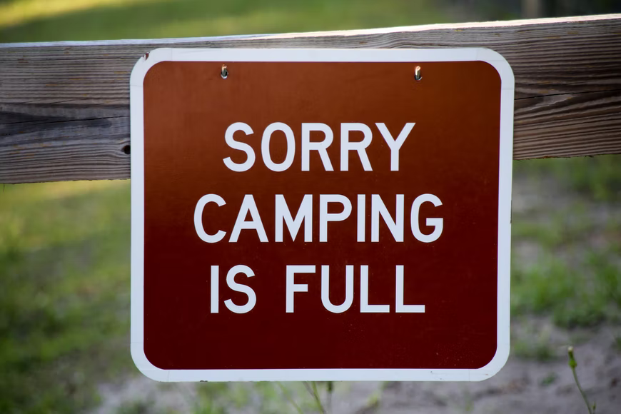a sign that says "sorry camping is full"