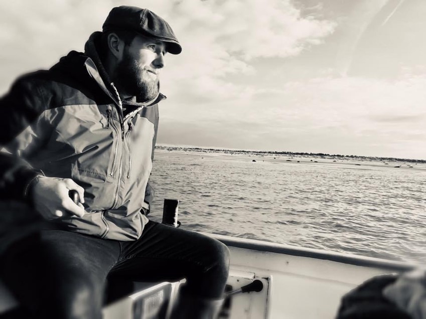 Josh Bean steering boat at Blakeney Point