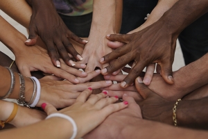 A bunch of hands touching