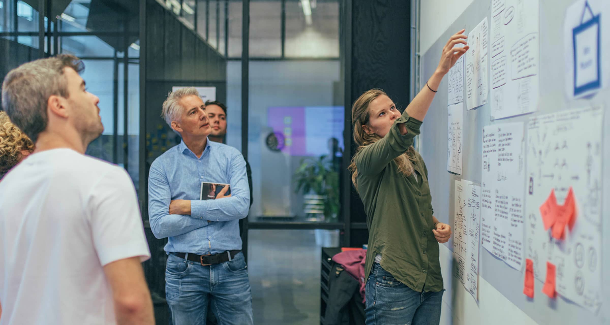 A view of our team working together with a client in a workshop