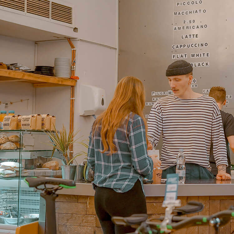 A customer using the 'Keep the change' function at a cash register