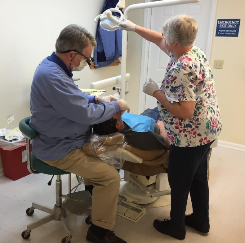 Maxine and Ken Horgan perform dental work at a clinic in Missouri.