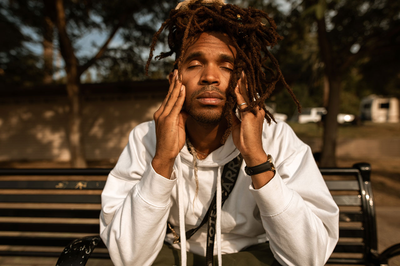 Stressed man sitting on a bench