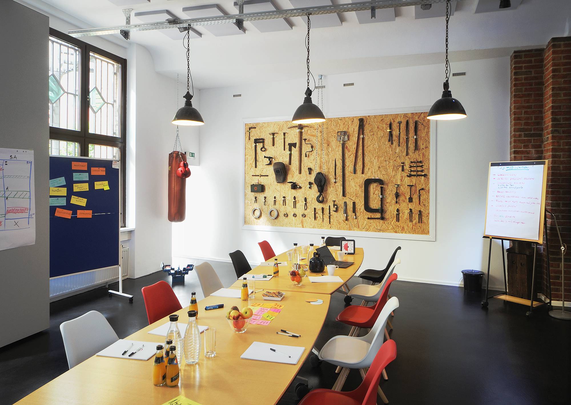 Meeet meeting room with tool wall and punch bag