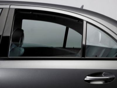 side view of a car power window pulled down half way