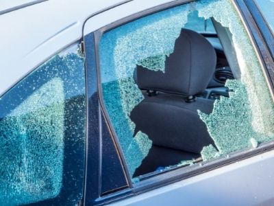 close up view of a shattered car glass window