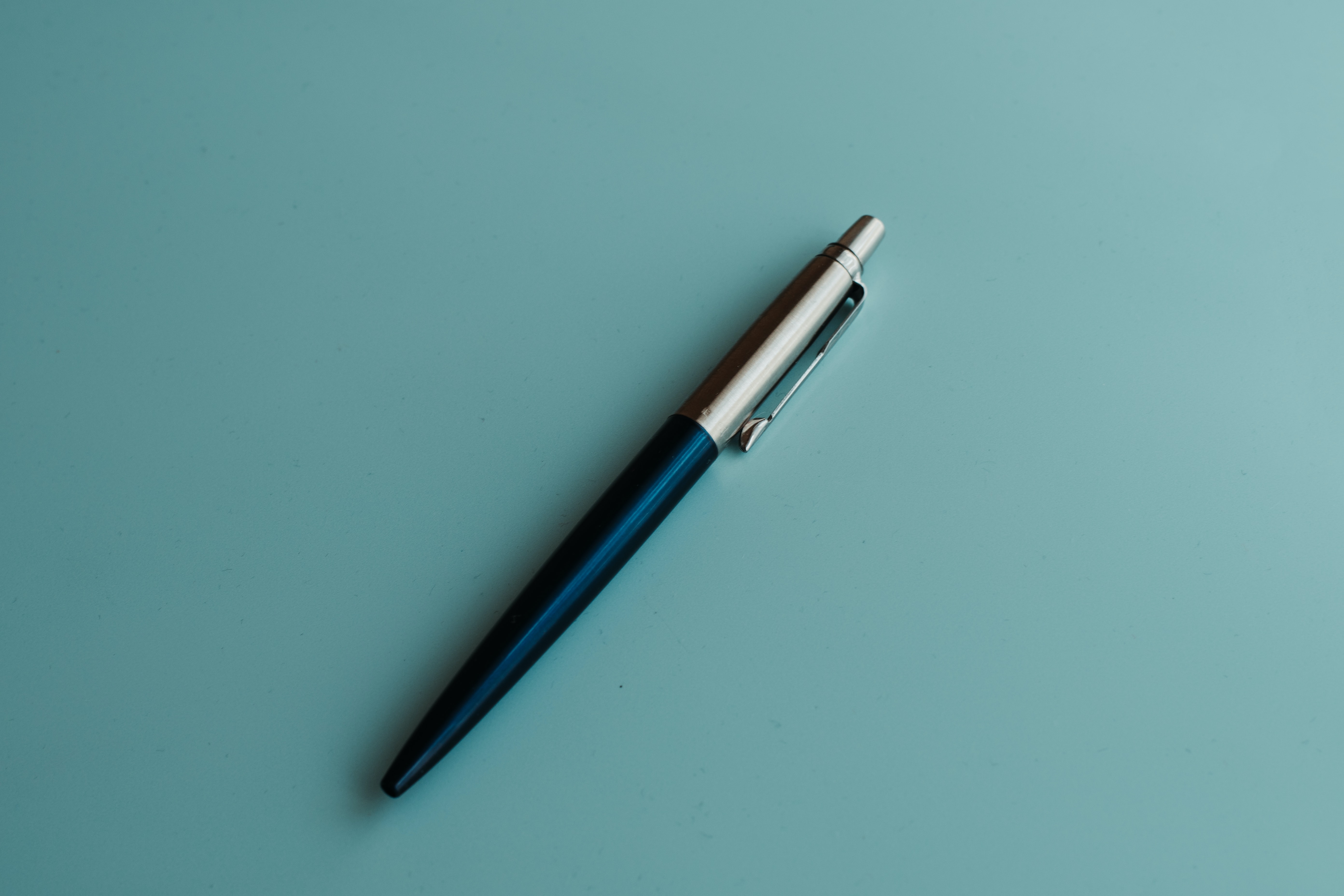 Parker pen on a blue background.