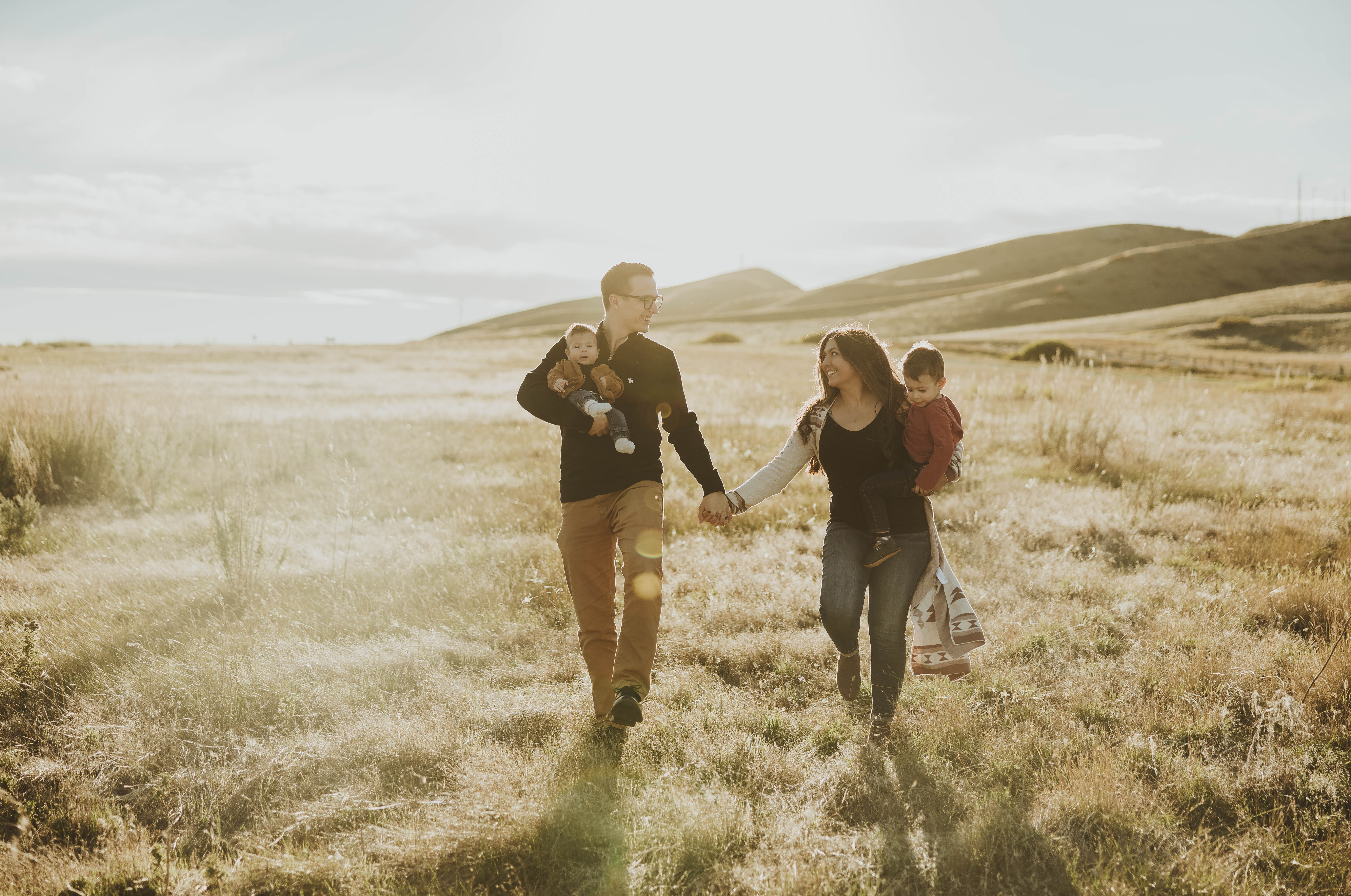 The Paterson Family walking through a field together