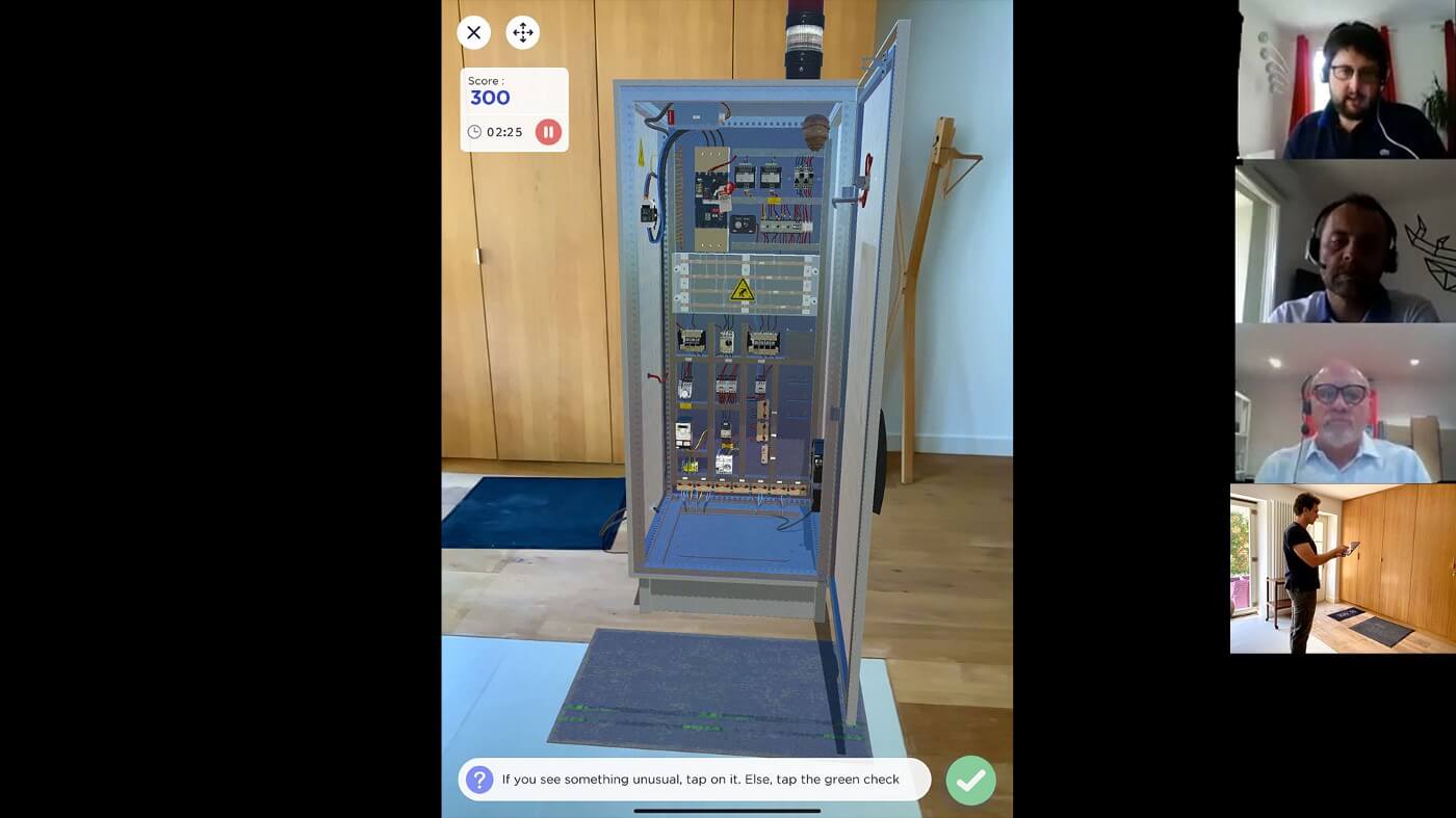 Trainee performing a Lockout /Tagout on an AR electrical enclosure, while sharing his iPad screen.