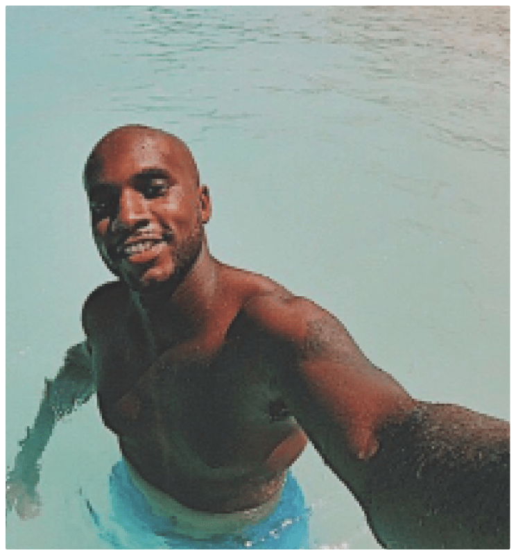 John D. Saunders in the ocean taking a selfie