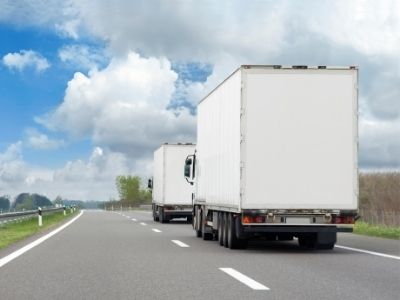 long distance moving trucks driving on the road