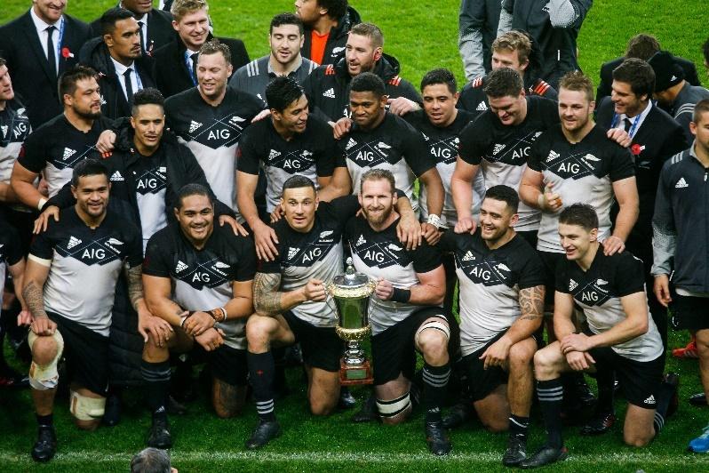 A group of men in sports uniforms posing for a photoDescription automatically generated with low confidence