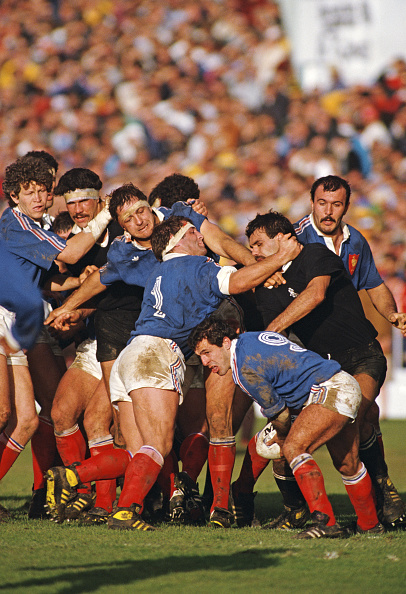 France scrum half Pierre Berbizier prepares to pass the ball as prop Pascal Ondarts (1) holds off All Black player Gary Whetton during the 1987 Rugby World Cup Final against New Zealand at Eden Park on June 20, 1987 in Auckland, New Zealand. (Photo Rusty Cheyne/ Allsport/Getty Images)