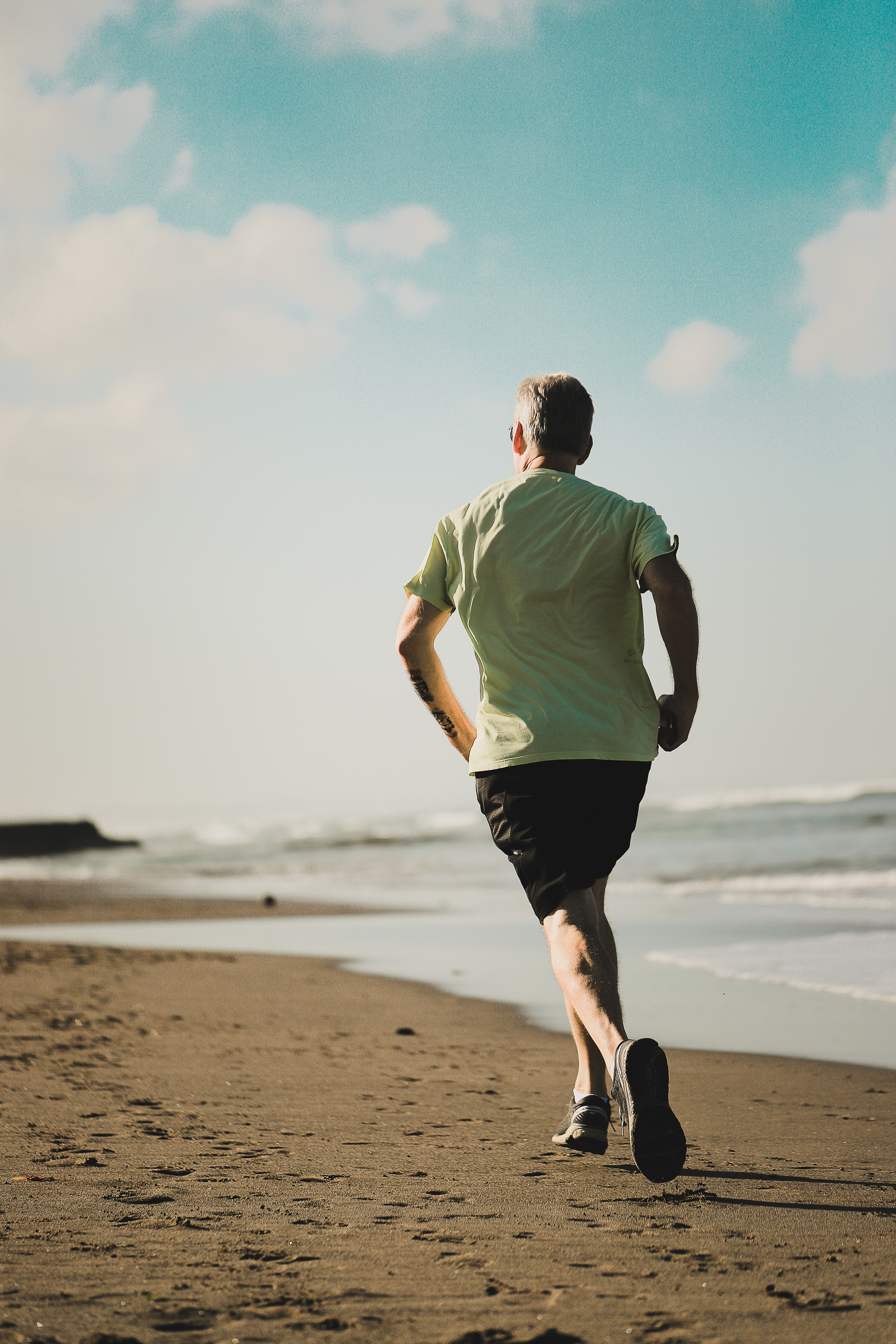 man running in a beach