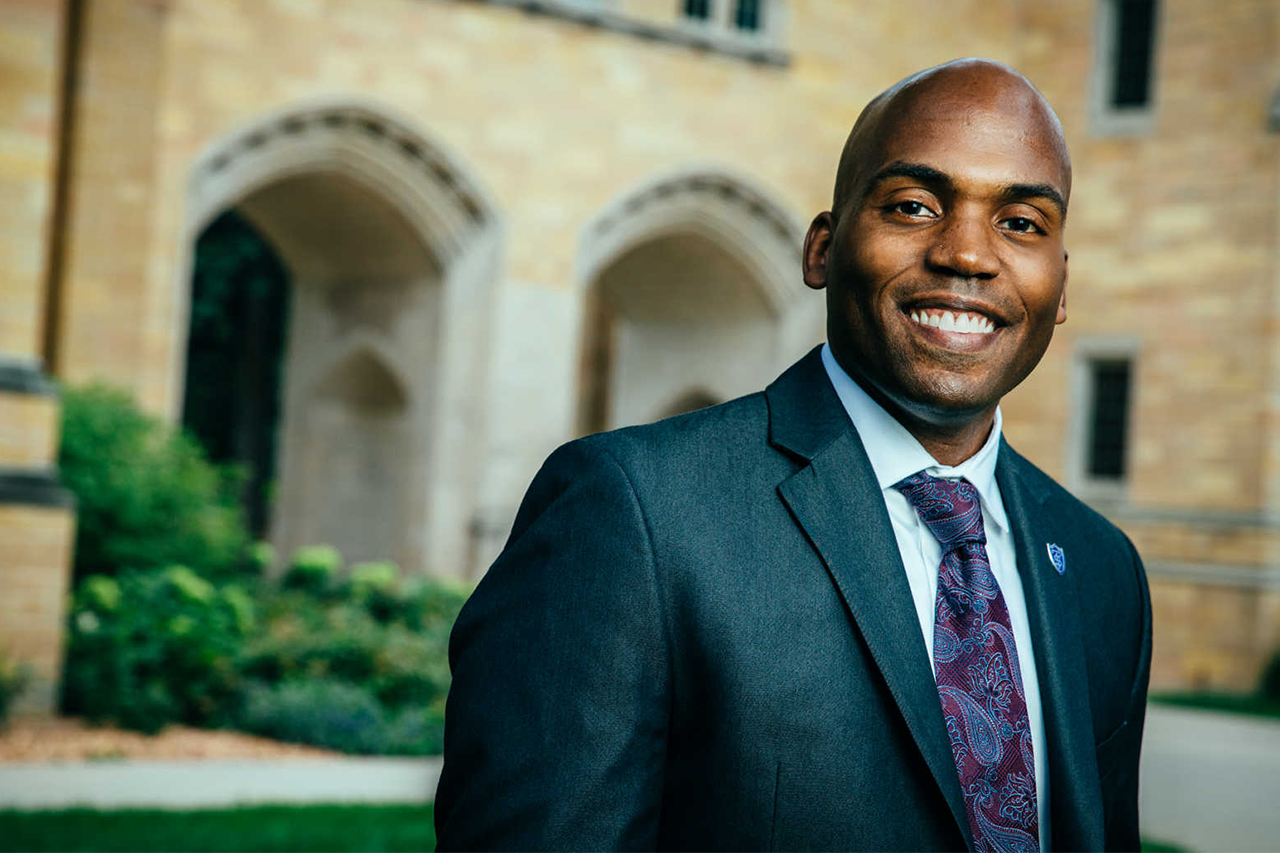 Dr. Yohuru Williams standing in front of arches.