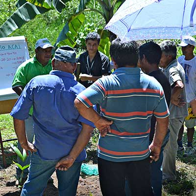 A group of community members meeting outside